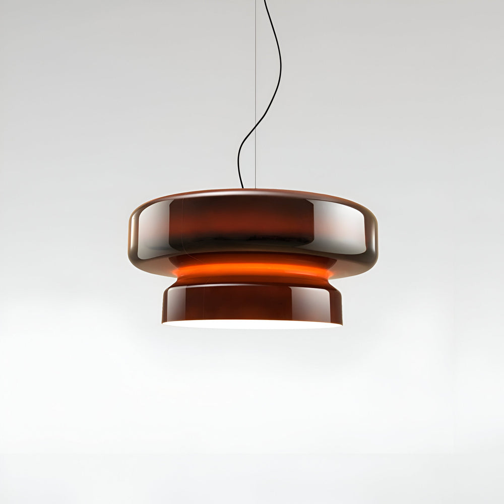 Colored glass pendant light in warm dining dining area