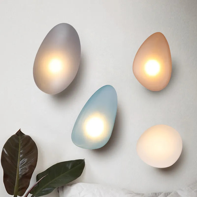 Nordic stained glass wall light in amber with rounded triangular glass shade