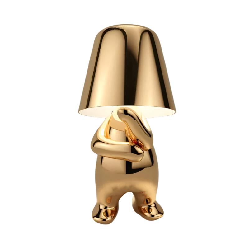 Modern sculptural rechargeable LED table lamp in gold, Thinking pose
